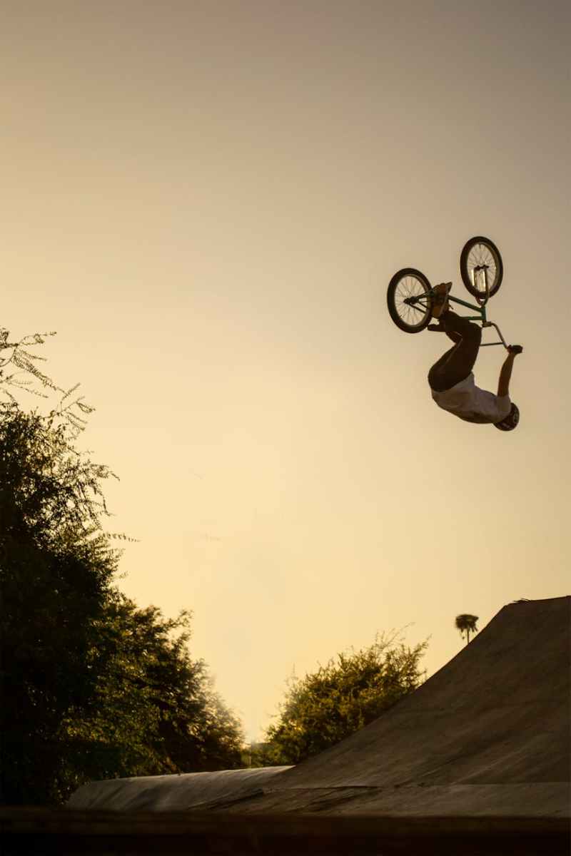 a person doing bmx tricks